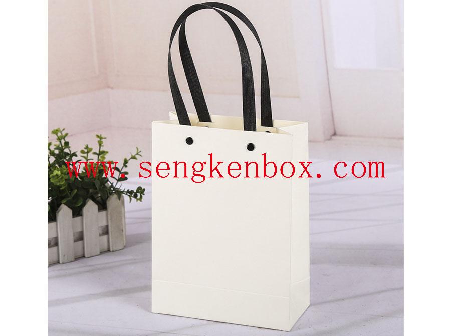 Paper Bag With Fixed Hand Hold